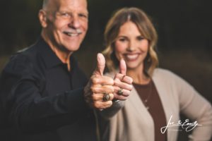 Man and daughter doing a thumbs up