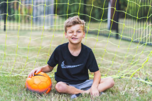 Boy in a soccer goal