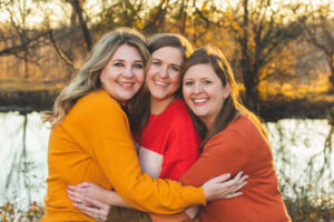 Three women hugging