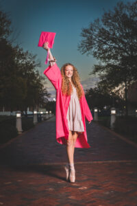 Girl posing in cap and gown