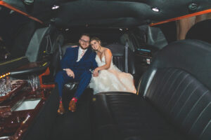 Bride and groom in limo