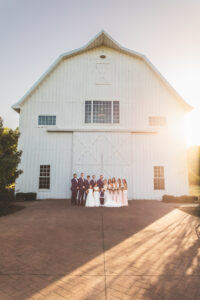 Bridal party outside of barn 